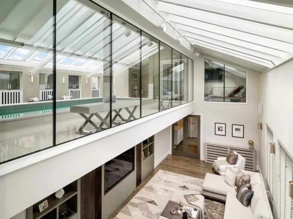 Living room and pool with a retractable roof