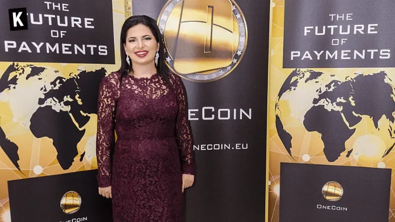 Ruja Ignatova, the "Crypto Queen", in front of OneCoin signs