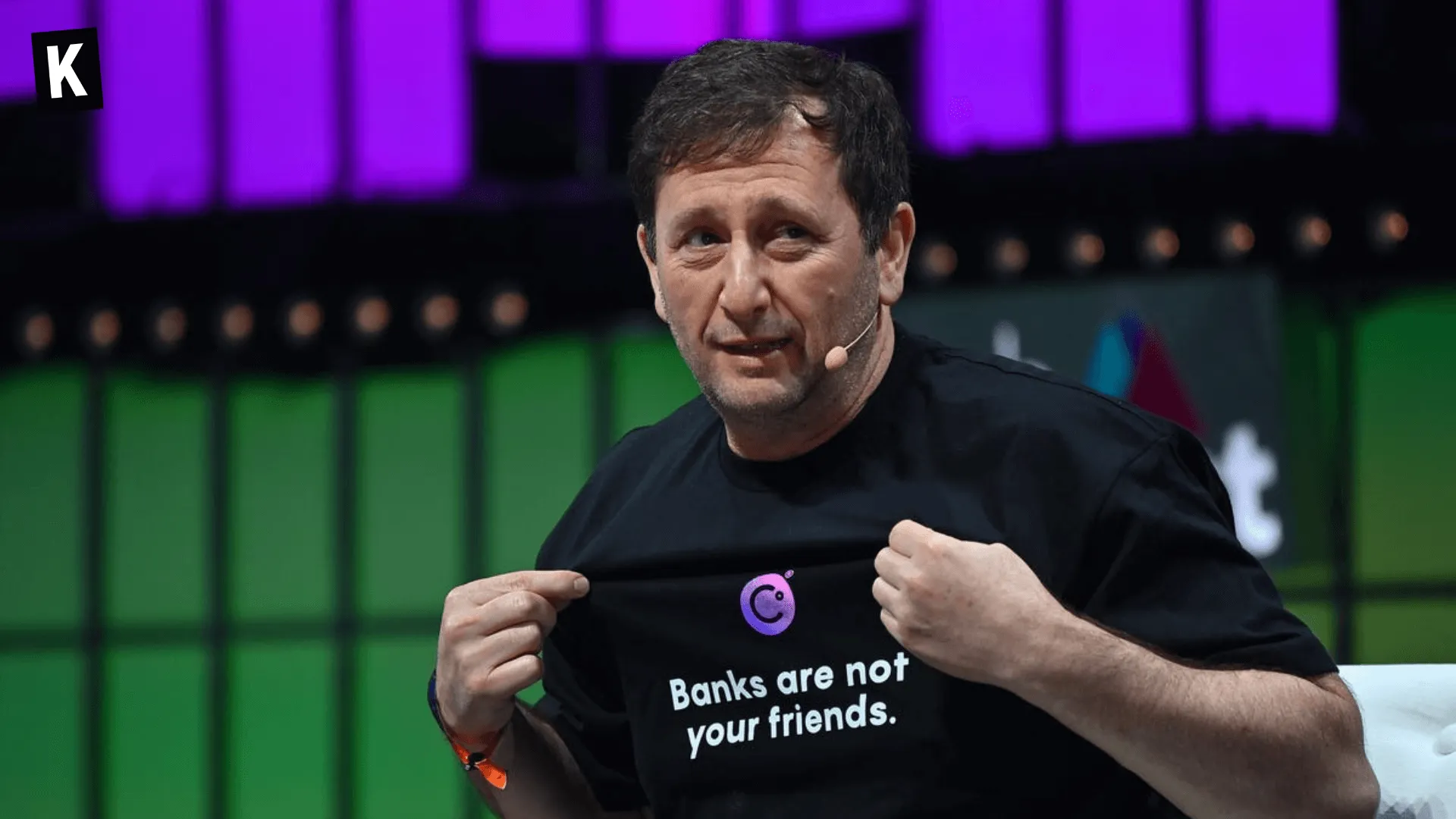 Alex Mashinsky wearing a t-shirt "Banks are not your friends" with a Celsius logo