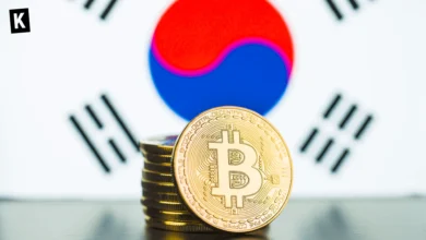Bitcoin stacked on a table with South Korean flag in the backgroung