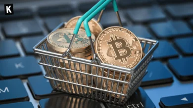 Bitcoins stacked in a basket on top of a laptop keyboard
