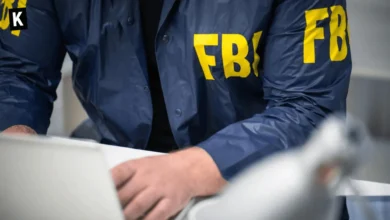 FBI agent working on a laptop
