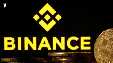 Binance logo on black background with crypto coins